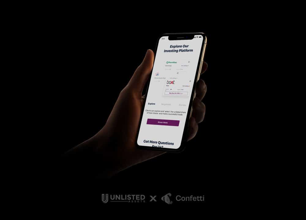 hand holding iphone with unlisted assets website on screen.