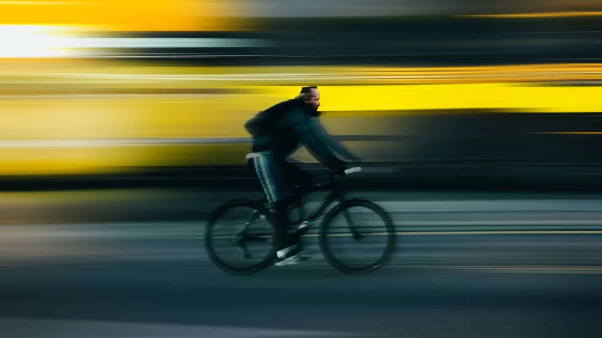 A person riding a bicycle  very fast, which represents going too fast as a founder